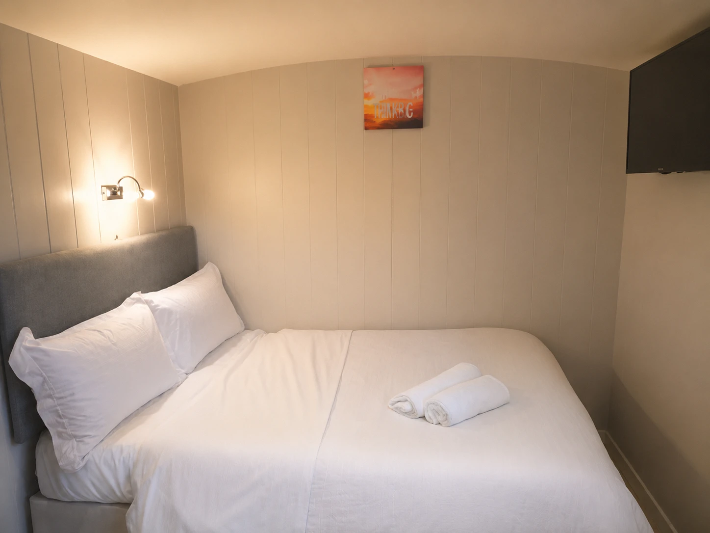 The bed inside the hut, dressed in fresh linen